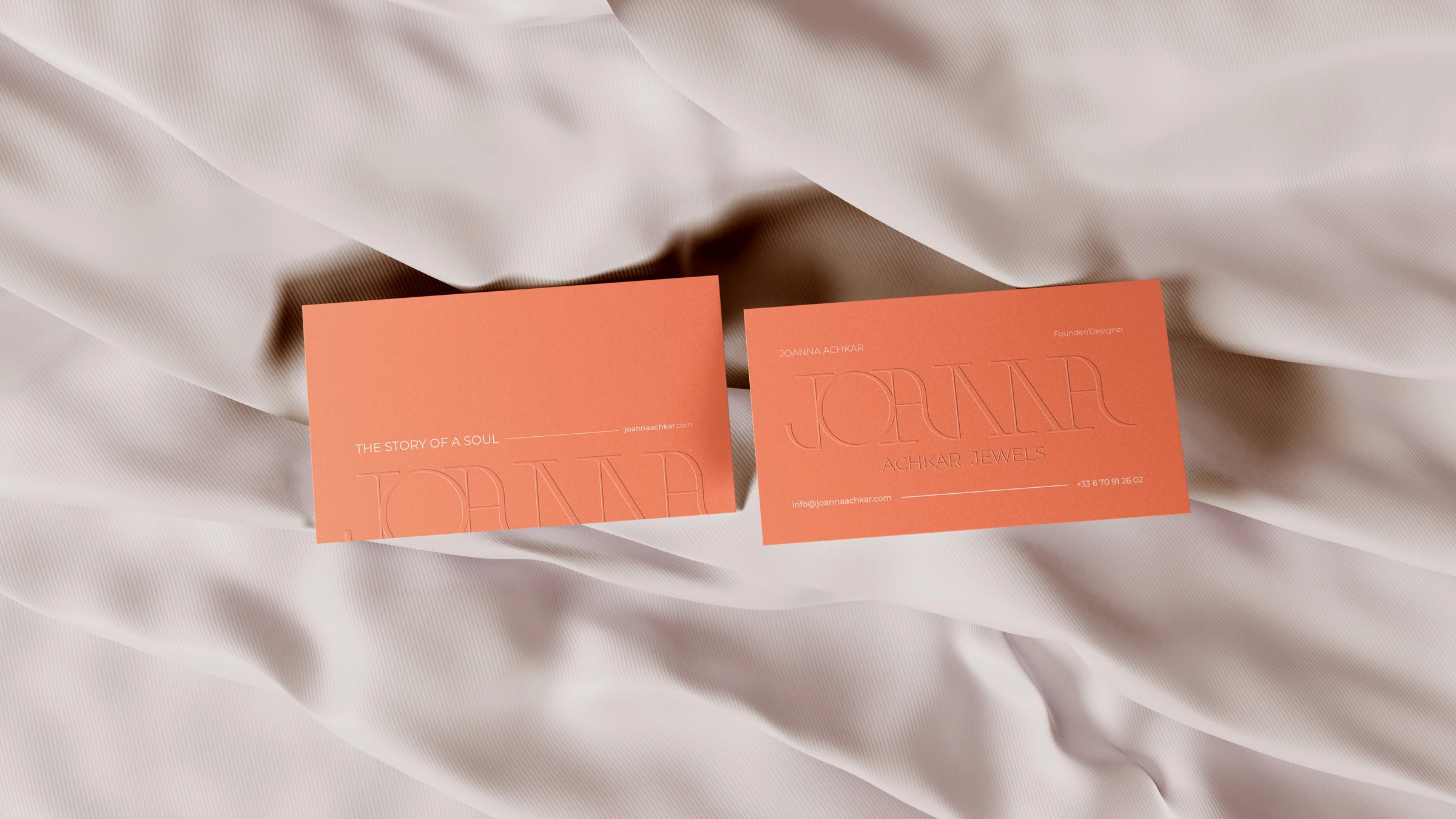 Coral Joanna Achkar stationery on pale fabric
