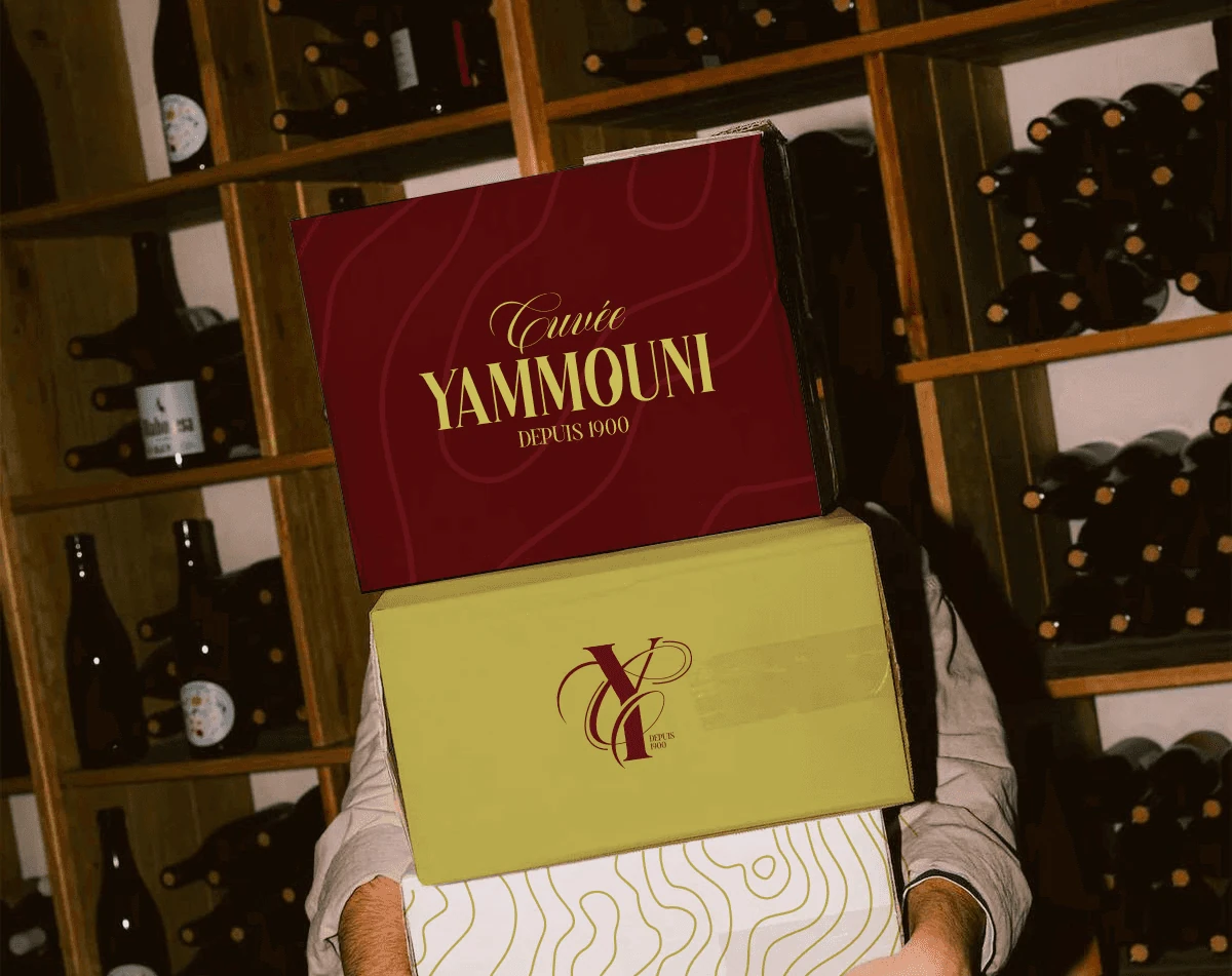 Close-up of Cuvée Yammouni wine packaging in burgundy and yellow